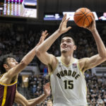 
              Purdue center Zach Edey (15) shoots during the second half of an NCAA college basketball game against Minnesota, Sunday, Dec. 4, 2022, in West Lafayette, Ind. (AP Photo/Doug McSchooler)
            