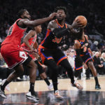 
              New York Knicks' Julius Randle, front right, tries to get past Chicago Bulls' Patrick Williams during the first half of an NBA basketball game, Friday, Dec. 23, 2022, in New York. (AP Photo/Seth Wenig)
            