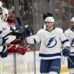 
              Tampa Bay Lightning center Brayden Point (21) greets teammates after scoring during the first period of an NHL hockey game against the Detroit Red Wings, Wednesday, Dec. 21, 2022, in Detroit. (AP Photo/Carlos Osorio)
            