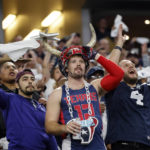 
              Houston Texans fans cheer during the second half of an NFL football game against the Dallas Cowboys , Sunday, Dec. 11, 2022, in Arlington, Texas. (AP Photo/Michael Ainsworth)
            
