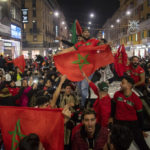 
              FILE - Morocco fans celebrate in Milan, Italy, after their victory against Spain in the World Cup round of 16 soccer match between Morocco and Spain, Tuesday, Dec. 6, 2022. (Claudio Furlan/Lapresse via AP, File)
            