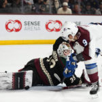 
              Arizona Coyotes goaltender Connor Ingram makes a save on a shot by Colorado Avalanche center Evan Rodrigues (9) during the second period of an NHL hockey game in Tempe, Ariz., Tuesday, Dec. 27, 2022. (AP Photo/Ross D. Franklin)
            