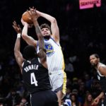 
              Brooklyn Nets' Edmond Sumner (4) defends a shot by Golden State Warriors' Ty Jerome (10) during the first half of an NBA basketball game Wednesday, Dec. 21, 2022 in New York. (AP Photo/Frank Franklin II)
            