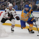 
              St. Louis Blues' Justin Faulk (72) handles the puck as Chicago Blackhawks' Jonathan Toews (19) defends during the third period of an NHL hockey game Thursday, Dec. 29, 2022, in St. Louis. (AP Photo/Jeff Roberson)
            