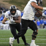 
              UCF running back Isaiah Bowser (5) runs the ball and scores a touchdown during the second half of the Military Bowl NCAA college football game against Duke, Wednesday, Dec. 28, 2022, in Annapolis, Md. (AP Photo/Terrance Williams)
            