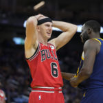 
              Chicago Bulls guard Alex Caruso (6) reacts next to Golden State Warriors Draymond Green during the first half of the team's NBA basketball game in San Francisco, Friday, Dec. 2, 2022. (AP Photo/Godofredo A. Vásquez)
            