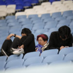 
              Fans of Japan react after Croatia won in the World Cup round of 16 soccer match between Japan and Croatia at the Al Janoub Stadium in Al Wakrah, Qatar, Monday, Dec. 5, 2022. (AP Photo/Eugene Hoshiko)
            