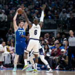 
              Dallas Mavericks guard Luka Doncic (77) attempts to pass the ball in the first half of an NBA basketball game in Dallas, Sunday, Dec. 25, 2022. (AP Photo/Emil T. Lippe)
            