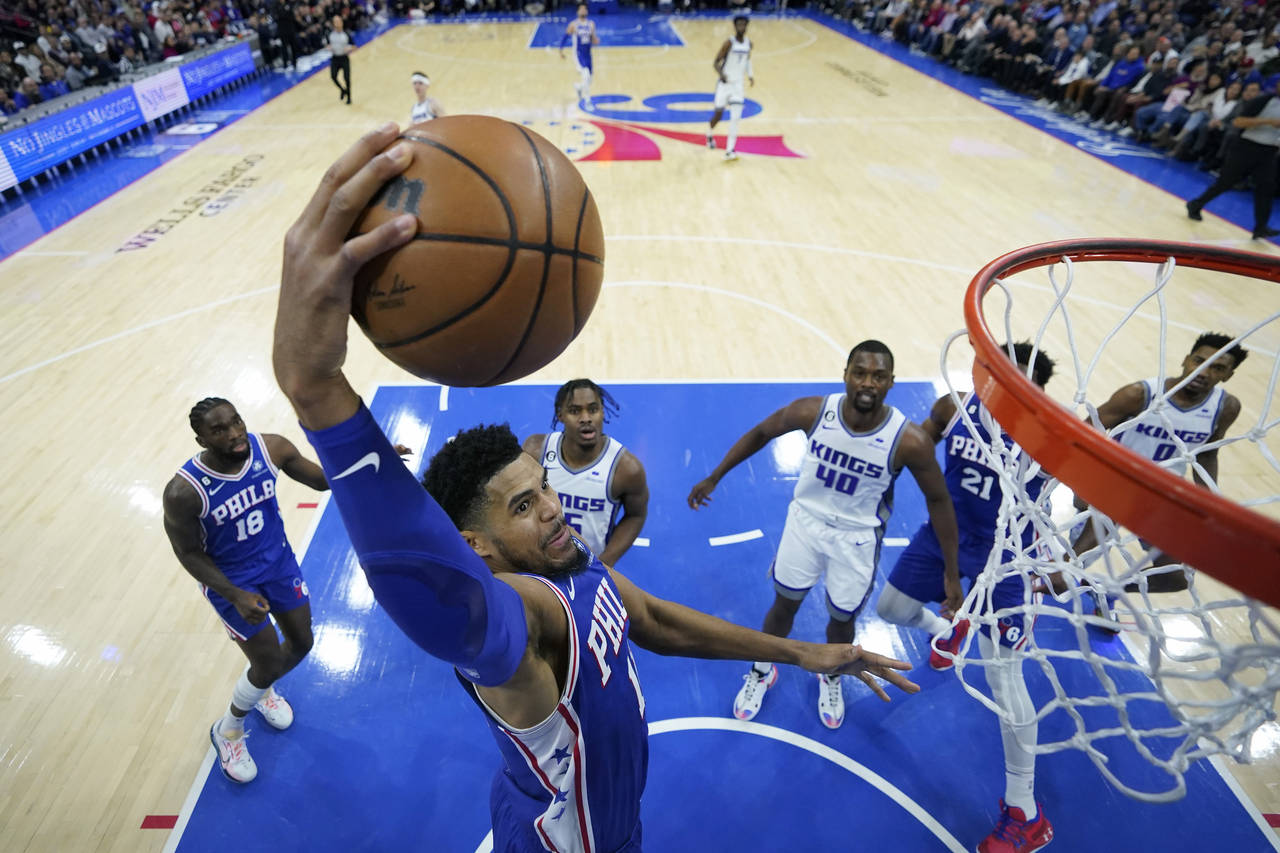 Philadelphia 76ers' Tobias Harris goes up for a dunk during the first half of an NBA basketball gam...