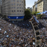 
              Argentine soccer fans descend on the capital's Obelisk to celebrate their team's World Cup victory over France, in Buenos Aires, Argentina, Sunday, Dec. 18, 2022. (AP Photo/Rodrigo Abd)
            