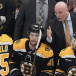 
              Boston Bruins head coach Jim Montgomery talks with his players during the first period of an NHL hockey game, Monday, Dec. 5, 2022, in Boston. (AP Photo/Charles Krupa, File)
            