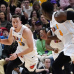 
              Miami Heat forward Duncan Robinson (55) looks to pass the ball to guard Victor Oladipo (4) during the first half of the team's NBA basketball game against the Utah Jazz, Saturday, Dec. 31, 2022, in Salt Lake City. (AP Photo/George Frey)
            