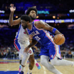 
              Philadelphia 76ers' Joel Embiid, right, tries to get past Detroit Pistons' Marvin Bagley III during the first half of an NBA basketball game, Wednesday, Dec. 21, 2022, in Philadelphia. (AP Photo/Matt Slocum)
            