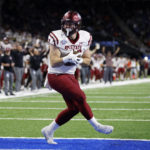 
              New Mexico State linebacker Eric Marsh scores on a pass reception against Bowling Green during the first half of the Quick Lane Bowl NCAA college football game, Monday, Dec. 26, 2022, in Detroit. (AP Photo/Al Goldis)
            