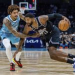 
              Charlotte Hornets guard Kelly Oubre Jr. guards LA Clippers guard Paul George (13) as he drives with the ball during the first half of an NBA basketball game on Monday, Dec. 5, 2022, in Charlotte, N.C. (AP Photo/Scott Kinser)
            