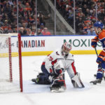 
              Washington Capitals goalie Charlie Lindgren (79) is scored on by Edmonton Oilers' Connor McDavid (97) during the second period of an NHL hockey game in Edmonton, Alberta, Monday, Dec. 5, 2022. (Jason Franson/The Canadian Press via AP)
            