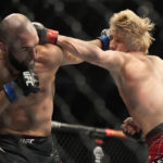 
              Paddy Pimblett, right, and Jared Gordon exchange blows during a UFC 282 mixed martial arts lightweight bout Saturday, Dec. 10, 2022, in Las Vegas. (AP Photo/John Locher)
            
