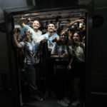 
              Argentina soccer fans celebrate their team's victory over Croatia after watching the team's World Cup semifinal match in Qatar on TV, as they enter the subway in Buenos Aires, Argentina, Tuesday, Dec. 13, 2022. (AP Photo/Rodrigo Abd)
            