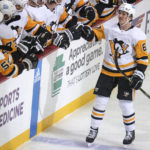 
              Pittsburgh Penguins' Rickard Rakell (67) returns to the bench after scoring against the Buffalo Sabres during the first period of an NHL hockey game in Pittsburgh, Saturday, Dec. 10, 2022. (AP Photo/Gene J. Puskar)
            