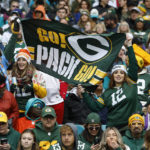
              Green Bay Packers fans cheer on their team during the first half of an NFL football game against the Miami Dolphins, Sunday, Dec. 25, 2022, in Miami Gardens, Fla. (AP Photo/Rhona Wise)
            