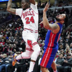 
              Chicago Bulls forward Javonte Green, left, looks to pass the ball as Detroit Pistons guard Cory Joseph defends during the first half of an NBA basketball game in Chicago, Friday, Dec. 30, 2022. (AP Photo/Nam Y. Huh)
            