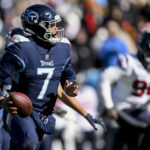 
              Tennessee Titans quarterback Malik Willis (7) runs out of the pocket against the Houston Texans during the first half of an NFL football game, Saturday, Dec. 24, 2022, in Nashville, Tenn. (AP Photo/John Amis)
            
