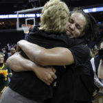 
              FILE - Baylor's Brittney Griner, right, picks up head coach Kim Mulkey after Baylor beat Duke 51-48 in the NCAA Memphis Regional championship college basketball game Monday, March 29, 2010, in Memphis, Tenn. Griner had for years been known to fans of women's basketball, college player of the year, a two-time Olympic gold medalist and WNBA all-star who dominated her sport. But her arrest on drug-related charges at a Moscow airport in February elevated her profile in ways neither she nor her supporters would have ever hoped for, making her by far the most high-profile American to be jailed abroad. (AP Photo/Mark Humphrey, File)
            