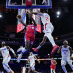 
              Philadelphia 76ers' Shake Milton (18) goes up for a shot against Los Angeles Clippers' Norman Powell (24) during the second half of an NBA basketball game, Friday, Dec. 23, 2022, in Philadelphia. (AP Photo/Matt Slocum)
            