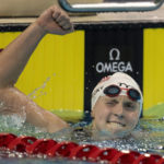 
              FILE - Katie Ledecky, of the United States, celebrates after breaking the world record in the 1500-meter freestyle at the FINA Swimming World Cup meet in Toronto on Saturday, Oct. 29, 2022. The American swimmer turned in another stellar performance at the world championships, set a pair of world records, and capped 2022 as The Associated Press Female Athlete of the Year by a panel of 40 sports writers and editors from news outlets across the country. (Frank Gunn/The Canadian Press via AP, File)
            