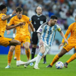 
              Argentina's Lionel Messi, second right, vies for the ball with Netherlands' defenders during the World Cup quarterfinal soccer match between the Netherlands and Argentina, at the Lusail Stadium in Lusail, Qatar, Friday, Dec. 9, 2022. (AP Photo/Francisco Seco)
            