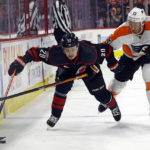 
              Carolina Hurricanes' Sebastian Aho (20) gets tied up with Philadelphia Flyers' Kevin Hayes (13) during the second period of an NHL hockey game in Raleigh, N.C., Friday, Dec. 23, 2022. (AP Photo/Karl B DeBlaker)
            