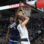 
              Minnesota Timberwolves guard Anthony Edwards (1) blocks the shot of Dallas Mavericks guard Luka Doncic (77) during the second half of an NBA basketball game, Wednesday, Dec. 21, 2022, in Minneapolis. (AP Photo/Abbie Parr)
            