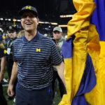 
              Michigan head coach Jim Harbaugh smiles after defeating Purdue in the Big Ten championship NCAA college football game, early Sunday, Dec. 4, 2022, in Indianapolis. Michigan won, 43-22. (AP Photo/Michael Conroy)
            