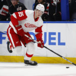 
              Detroit Red Wings left wing Elmer Soderblom (85) carries the puck into the zone during the second period of the team's NHL hockey game against the Buffalo Sabres, Thursday, Dec. 29, 2022, in Buffalo, N.Y. (AP Photo/Jeffrey T. Barnes)
            