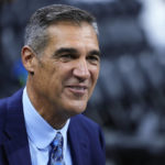 
              FILE - Former Villanova head coach Jay Wright smiles before an NCAA college basketball game between Villanova and Oklahoma, Saturday, Dec. 3, 2022, in Philadelphia. Jay Wright, the Hall of Fame coach who built Villanova from sleepy Big East school into a national power and won two national championships before he shocked the sport in April and retired at 60 after one last Final Four, is set to make his debut as a game analyst for CBS Sports on Wednesday night, Dec. 7, when his old Wildcats play Penn.(AP Photo/Matt Slocum, File)
            
