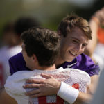 
              Clemson Tigers quarterback Cade Klubnik (2) hugs a teammate at the start of a practice session ahead of the 2022 Orange Bowl, Wednesday, Dec. 28, 2022, in Fort Lauderdale, Fla. Clemson will face the Tennessee Volunteers in the Orange Bowl on Friday, Dec. 30. (AP Photo/Rebecca Blackwell)
            
