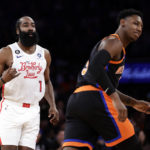 
              Philadelphia 76ers guard James Harden (1) reacts after making a three-point basket against New York Knicks guard RJ Barrett during the first half of an NBA basketball game, Sunday, Dec. 25, 2022, in New York. (AP Photo/Adam Hunger)
            