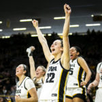 
              Iowa guard Caitlin Clark (22) cheers on teammates during an NCAA college basketball game against Dartmouth, Wednesday, Dec. 21, 2022, at Carver-Hawkeye Arena in Iowa City, Iowa. Caitlin Clark had 20 points, 10 rebounds and six assists, and reached 2,000 career points as No. 13 Iowa beat Dartmouth 92-54 for its fifth straight victory. (Joseph Cress/Iowa City Press-Citizen via AP)
            