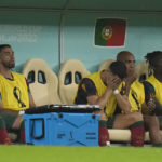 
              Portugal's Cristiano Ronaldo, third from right, sits on the bench during the World Cup round of 16 soccer match between Portugal and Switzerland, at the Lusail Stadium in Lusail, Qatar, Tuesday, Dec. 6, 2022. (AP Photo/Alessandra Tarantino)
            