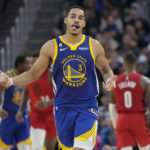 
              Golden State Warriors guard Jordan Poole (3) gestures after 3-point basket during the first half of the team's NBA basketball game against the Portland Trail Blazers in San Francisco, Friday, Dec. 30, 2022. (AP Photo/Jeff Chiu)
            