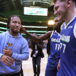 
              New York Knicks guard Jalen Brunson, left, is greeted by Dallas Mavericks forward Tim Hardaway Jr. (11) and guard Luka Doncic after an NBA basketball game in Dallas, Tuesday, Dec. 27, 2022. The Mavericks won in overtime, 126-121. (AP Photo/LM Otero)
            