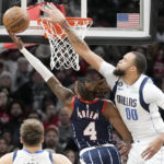 
              Houston Rockets guard Jalen Green (4) shoots as Dallas Mavericks center JaVale McGee (00) defends during the first half of an NBA basketball game, Friday, Dec. 23, 2022, in Houston. (AP Photo/Eric Christian Smith)
            