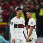 
              Portugal's Cristiano Ronaldo, left, and Portugal's Goncalo Ramos react end of the World Cup quarterfinal soccer match between Morocco and Portugal, at Al Thumama Stadium in Doha, Qatar, Saturday, Dec. 10, 2022. (AP Photo/Petr David Josek)
            