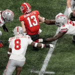 
              Georgia quarterback Stetson Bennett (13) is sacked against Ohio State during the first half of the Peach Bowl NCAA college football semifinal playoff game, Saturday, Dec. 31, 2022, in Atlanta. (AP Photo/Brynn Anderson)
            
