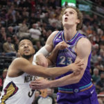 
              New Orleans Pelicans guard CJ McCollum (3) and Utah Jazz forward Lauri Markkanen (23) battle for position under the boards during the first half of an NBA basketball game Thursday, Dec. 15, 2022, in Salt Lake City. (AP Photo/Rick Bowmer)
            