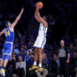 
              UCLA guard Jaime Jaquez Jr. defends Kentucky forward Jacob Toppin during the second half of an NCAA college basketball game in the CBS Sports Classic, Saturday, Dec. 17, 2022, in New York. The Bruins won 63-53. (AP Photo/Julia Nikhinson)
            