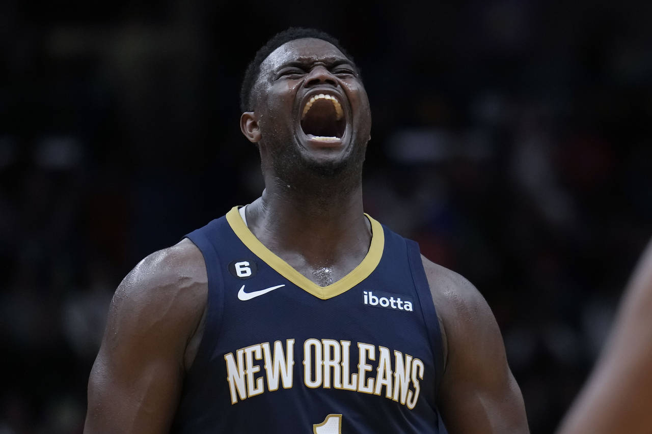 New Orleans Pelicans forward Zion Williamson (1) reacts after being fouled on a 3-point play in the...