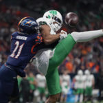 
              UTSA cornerback Ken Robinson (21) breaks up a pass intended for North Texas wide receiver Jyaire Shorter during the first half of an NCAA college football game for the Conference USA championship in San Antonio, Friday, Dec. 2, 2022. (AP Photo/Eric Gay)
            