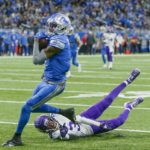 
              Detroit Lions' DJ Chark catches a touchdown pass in front of Minnesota Vikings' Cameron Dantzler Sr. during the first half of an NFL football game Sunday, Dec. 11, 2022, in Detroit. (AP Photo/Duane Burleson)
            