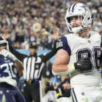 
              Dallas Cowboys tight end Dalton Schultz (86) runs into the end zone after a catch for a touchdown against Tennessee Titans cornerback Tre Avery (30) during the second half of an NFL football game, Thursday, Dec. 29, 2022, in Nashville, Tenn. (AP Photo/Chris Carlson)
            